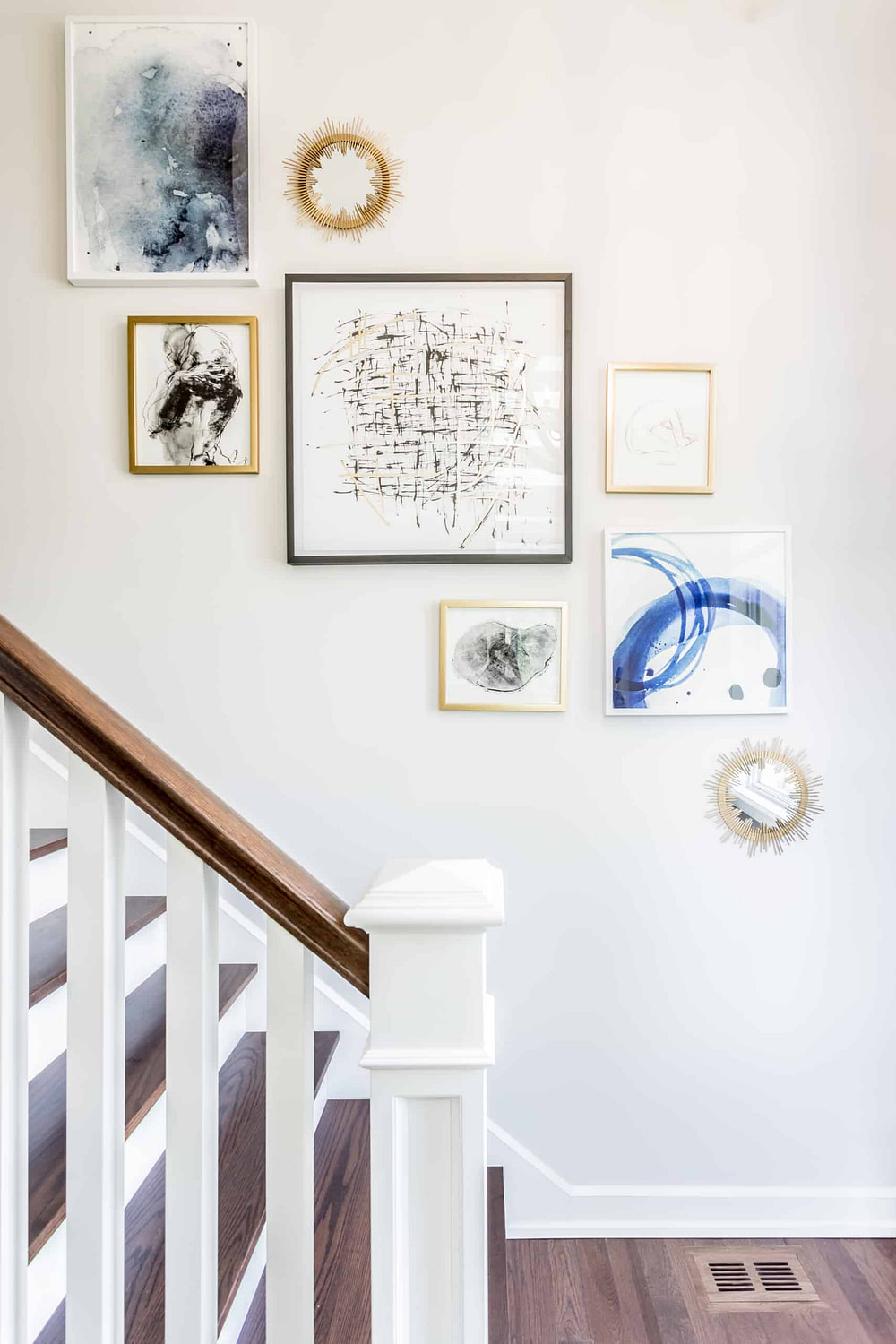 Pictures against the wall of the staircase