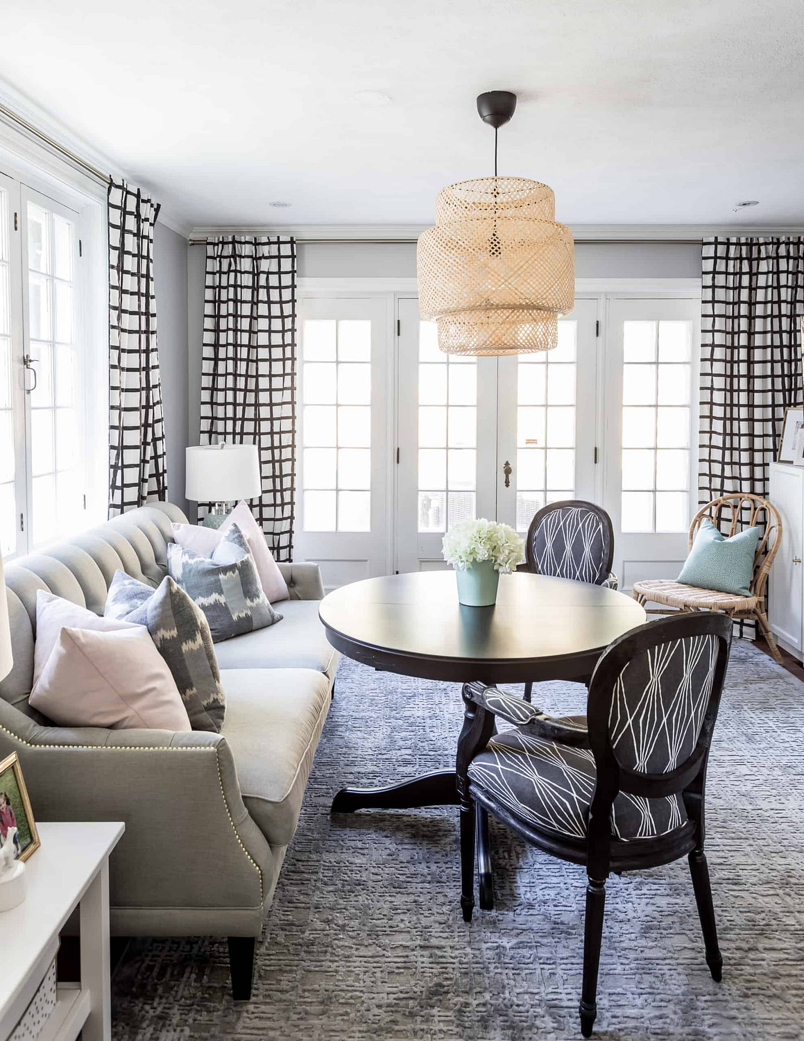 Colorful dining room with a wicker chandelier