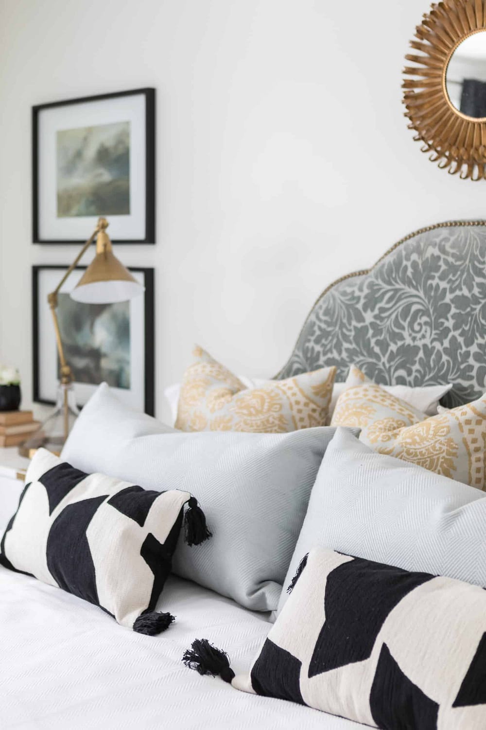 Array of pillows on a large bed