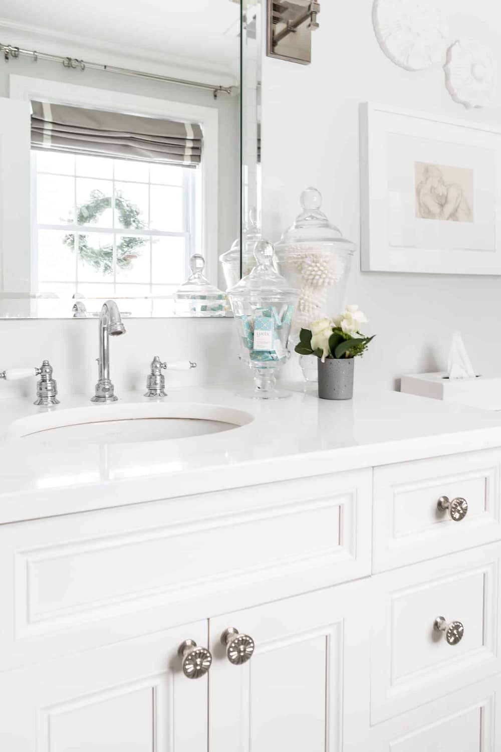 Bright white vanity inside a modern, clean bathroom