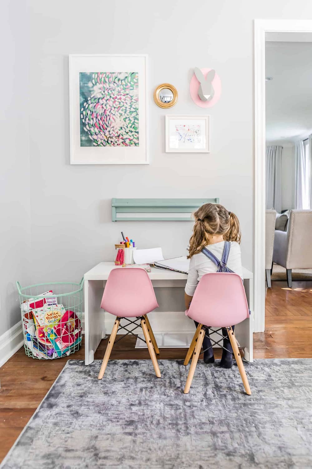 Small, pink stools at a small workspace