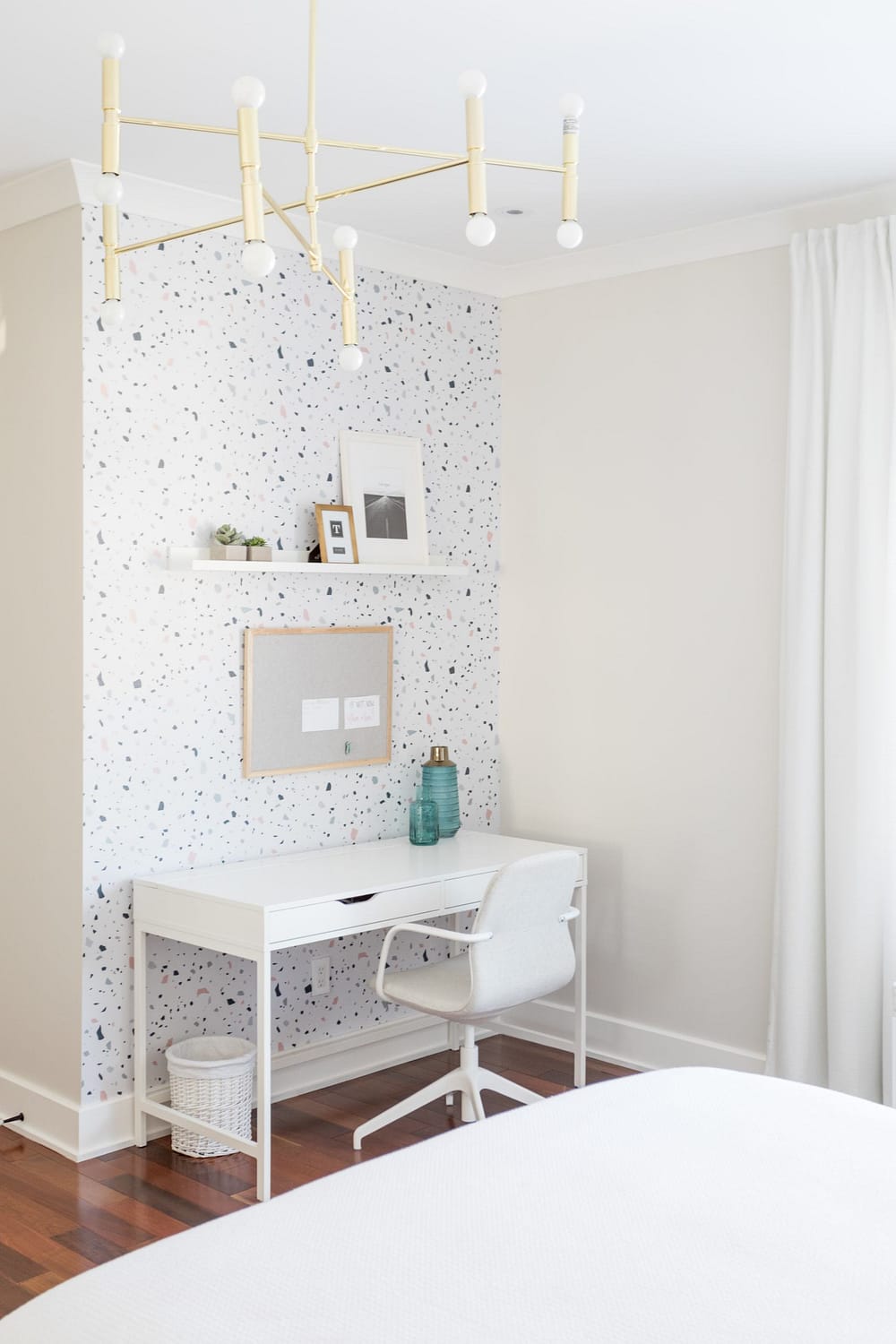 Small office space with a wallpaper on the wall