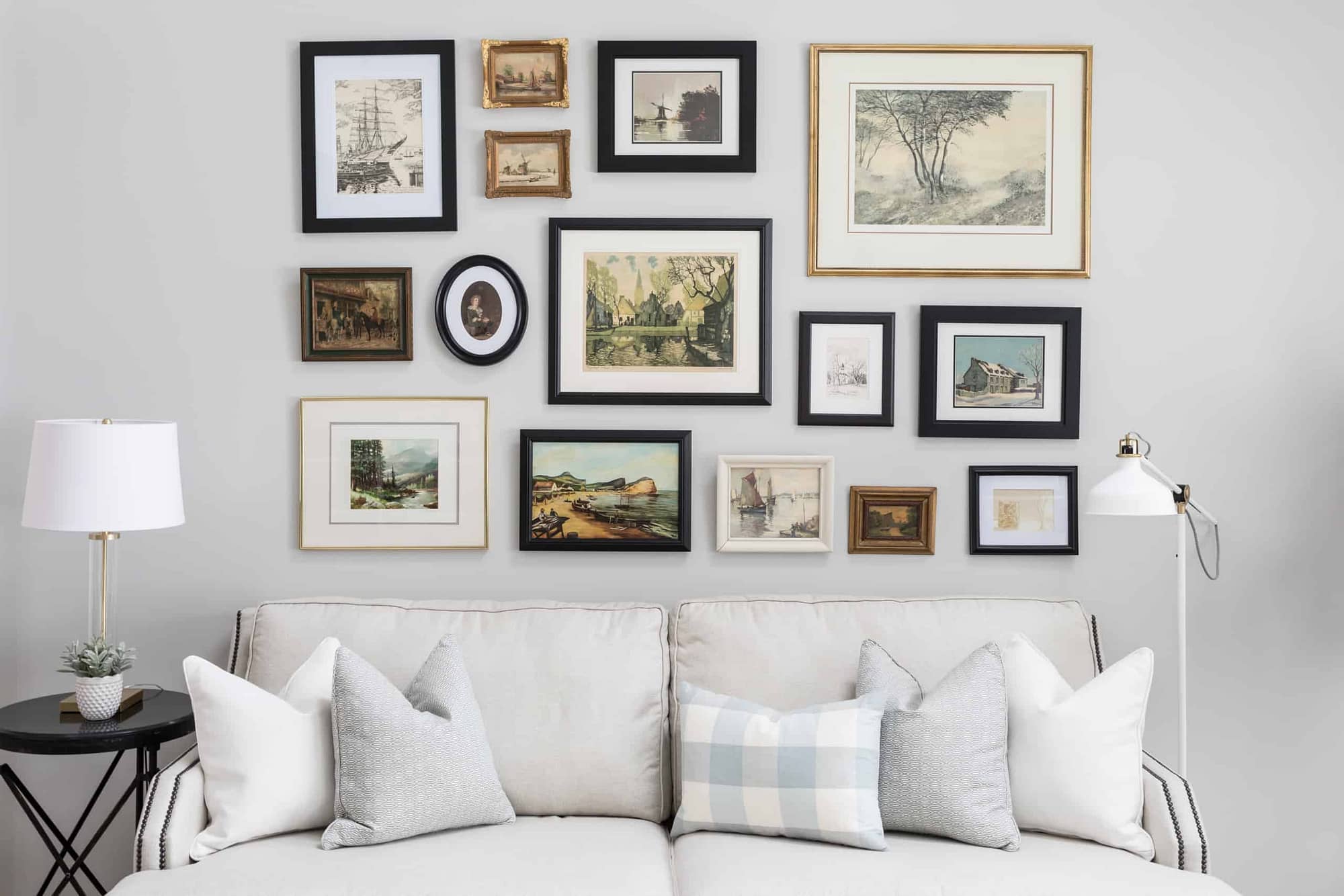 A large amount of pictures above the couch