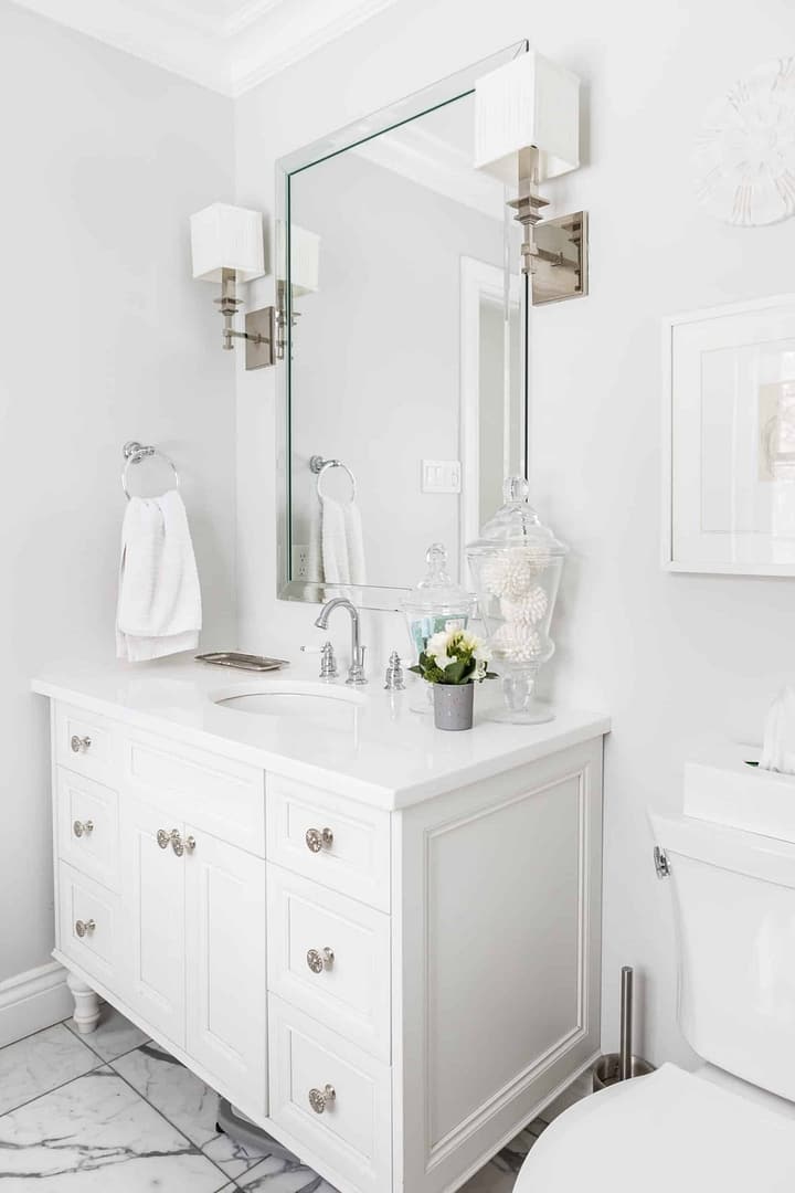 Bright white vanity inside a modern, clean bathroom