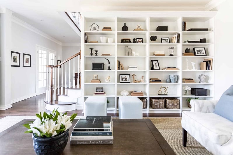 Wall covered in bookcases inside the living room